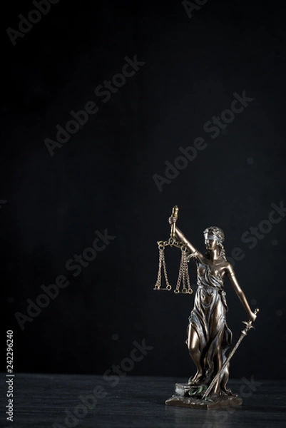 Fototapeta  Goddess of justice on a beautiful black background. the subject of law