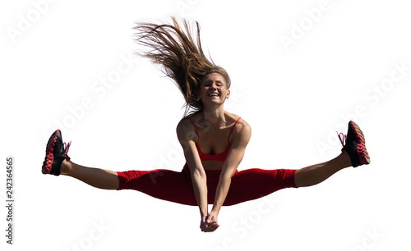 Fototapeta Young caucasian girl performs twine jumping on isolated backround. Lifestyle and sport concept