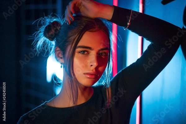 Obraz Close-up portrait of a girl in the studio with neon lights