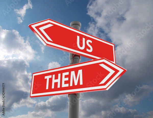Fototapeta us and them road signs pointing in different directions