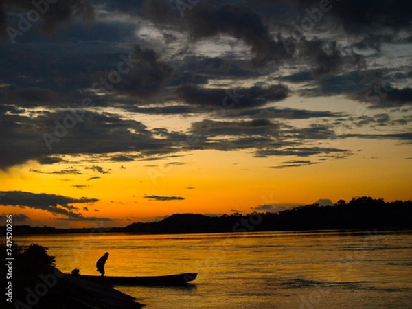 Fototapeta Fisherman in the sunset