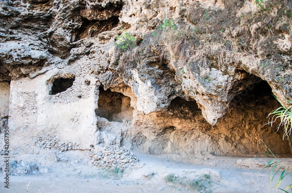 Fototapeta 2400 year old Buddhist era murals of Buddha appear on the walls of caves near Islamabad 