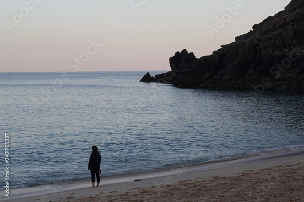 Obraz man walking on beach at sunset