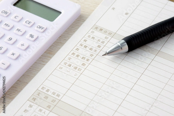 Fototapeta 家計簿と電卓