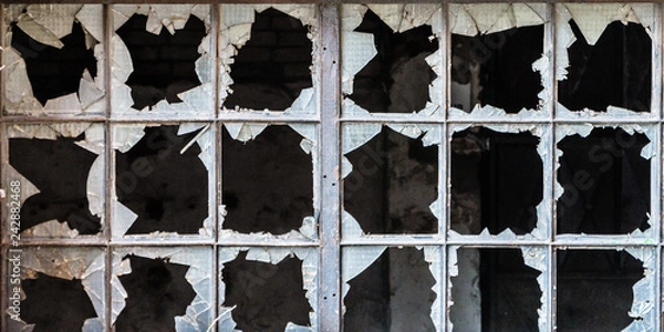 Obraz Broken glass in iron frame window