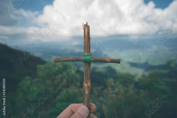 Fototapeta The cross with nature in the forest on the hill is the Blackground.