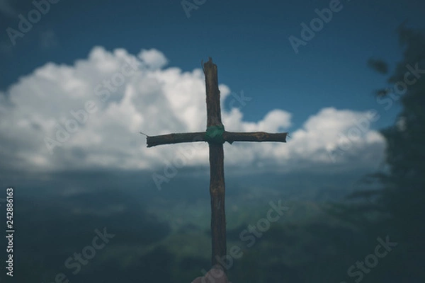 Fototapeta The cross with nature in the forest on the hill is the Blackground.