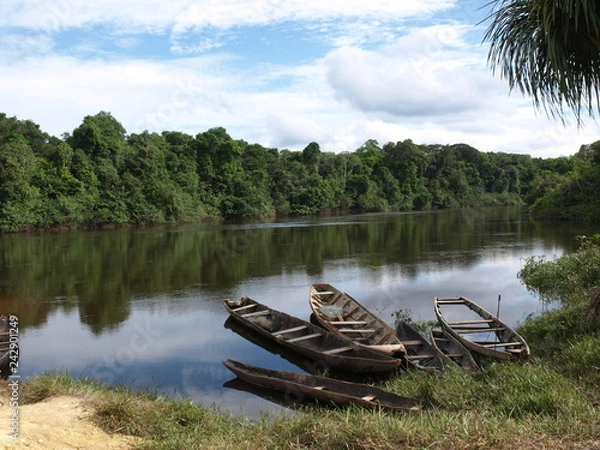 Fototapeta canoes in the river side
