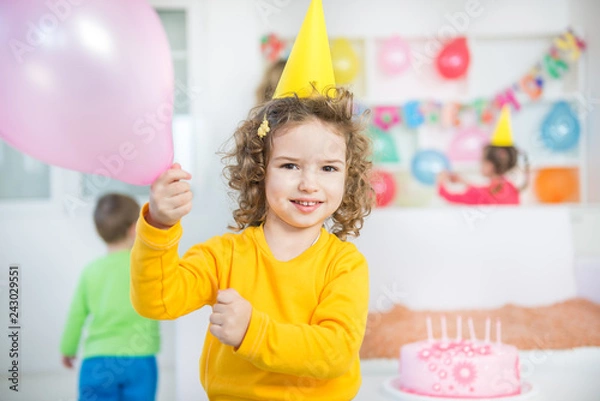 Fototapeta A group of children at a birthday party. blurred motion and shallow doff.