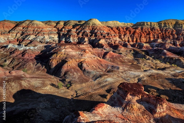 Obraz Rainbow City, Wucai Cheng. Colorful Red, Pink, Orange and Yellow landforms in a remote desert area of Fuyun County - Altay Perfecture, Xinjiang Province Uygur Autonomous Region, China. Rainbow Hills