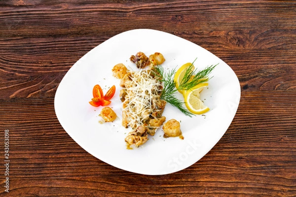 Obraz Seafood on a plate on a wooden table, a dish for the menu and advertising.