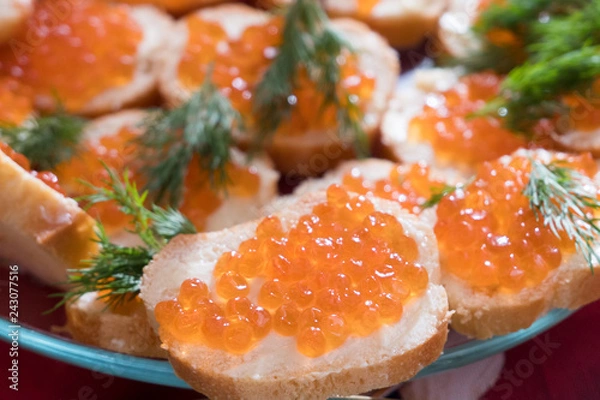 Fototapeta Sandwiches with caviar and butter on a glass platter
