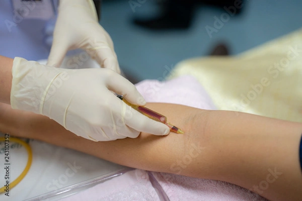 Fototapeta Intravenous  injection  With a syringe