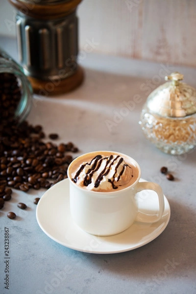 Fototapeta cup of coffee with whipped cream and beans
