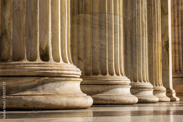 Fototapeta Classical marble pillars detail on the facade of a building