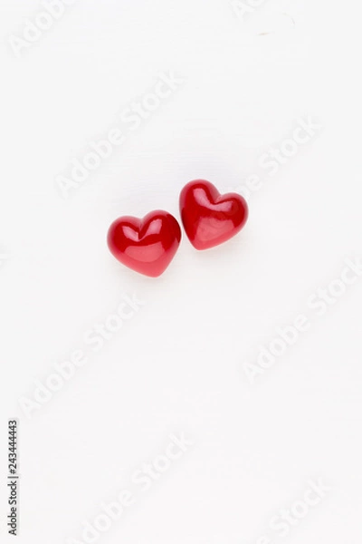 Fototapeta Creative composition for Valentines day with waffle cone, mixed hearts on white background top view. Fashion flat lay.