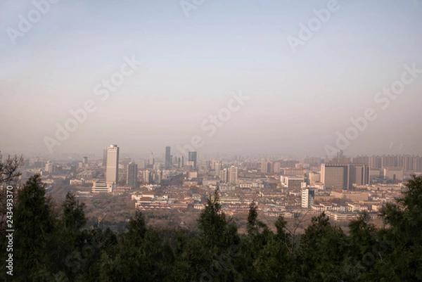 Fototapeta view of Jinan city from thousand Buddha mountain in autumn evening, China
