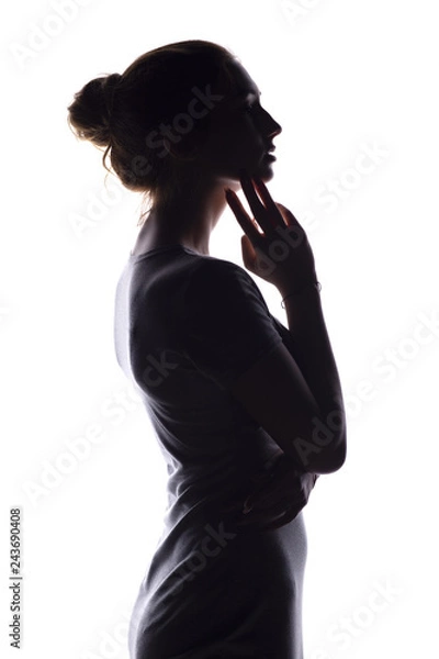 Obraz silhouette of a calm young woman on a white isolated background, figure of slim pensive girl