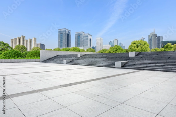 Fototapeta Empty square floor and modern commercial building in Shanghai