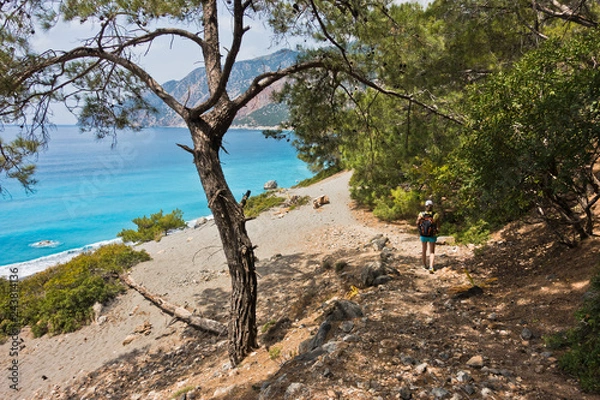 Fototapeta Downhill to Agios Pavlos beach from e4 trail between Loutro and Agia Roumeli at south-west od Crete island, Greece