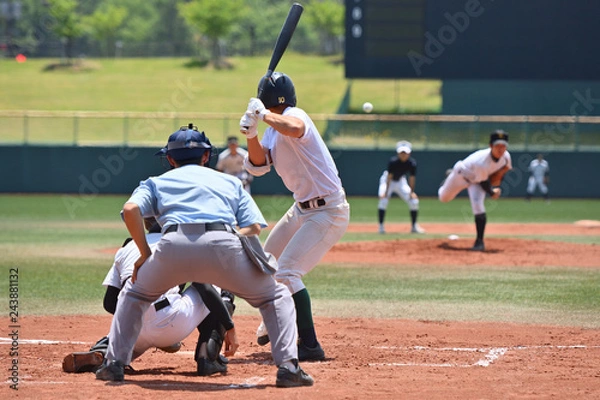 Fototapeta 高校野球の試合で打者に投げる投手