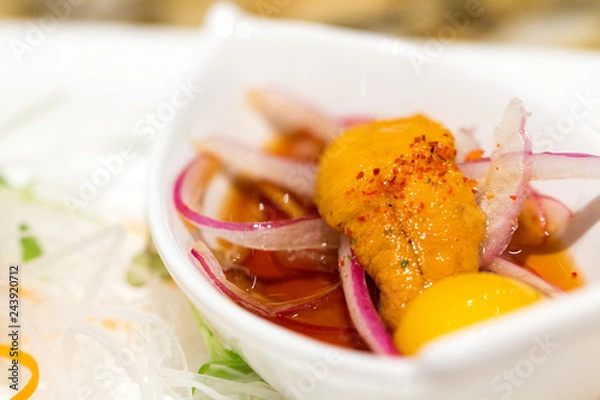 Fototapeta closeup of uni with egg, Japanese cuisine starter
