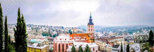 Fototapeta Panoramic view of Stiftskirche church with Baden-baden small cute town in winter fairytale in the Black Forest southwest of Germany. Famous German city with spa for vacations, holidays.