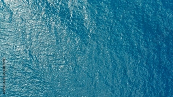 Obraz aerial drone image of the deep blue clear sea ocean water with small waves rolling
