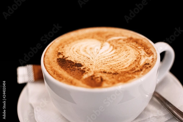 Fototapeta Cup Of Coffee With Whipped Cream And Cinnamon