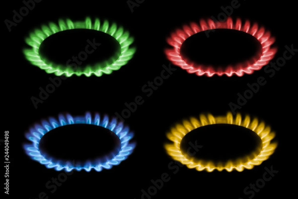 Fototapeta gas burns with red, blue, yellow, green flame on a black background, a collage and three different-colored burning gas