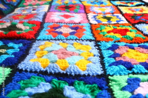 Fototapeta Multicolored handmade plaid of crochet made of granny squares