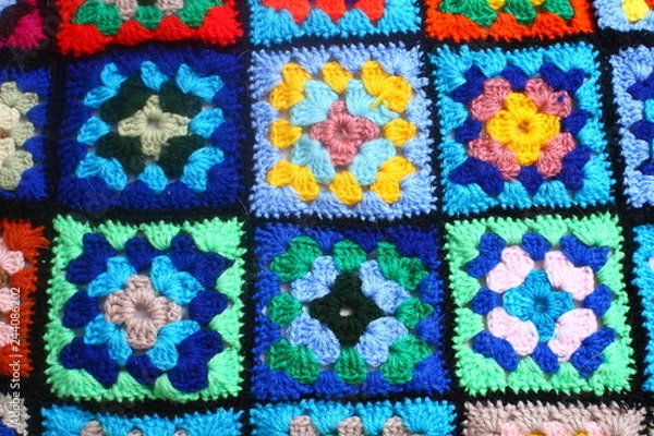 Fototapeta Multicolored handmade plaid of crochet made of granny squares