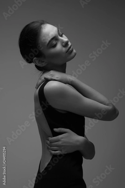 Fototapeta black and white photo of young woman  in black bodysuit torzo art posing beautiful skin fashion model  