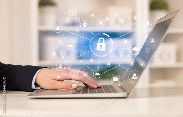 Fototapeta Business woman below chest working on laptop in a cozy homey environment with secured connection concept
