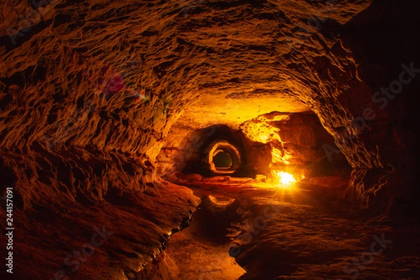 Obraz stone cave lit by warm light