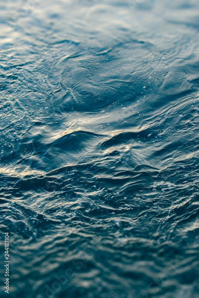 Fototapeta Blue and turquoise water with irregular wave structure