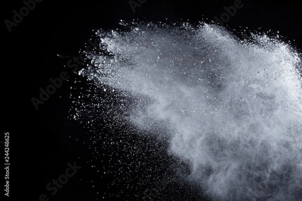Fototapeta White powder explosion on black background. Colored cloud. Colorful dust explode. Paint Holi.