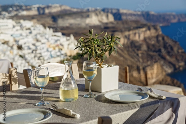 Fototapeta Table with a bottle of wine and glasses