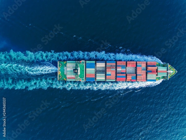Obraz Aerial top view container ship full speed for logistics , import export, shipping or transportation.
