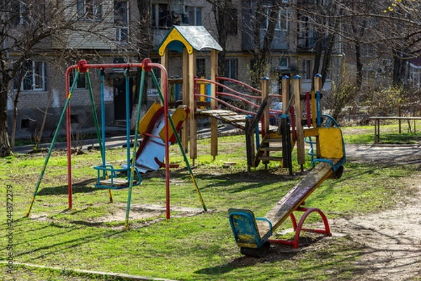 Obraz an old playground stands in the courtyard of a residential building