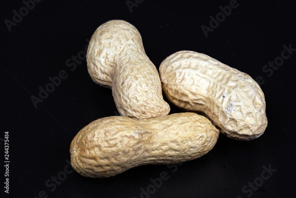 Fototapeta Peanuts in shell black backround