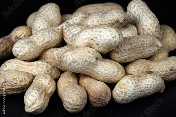 Fototapeta Peanuts in shell black backround
