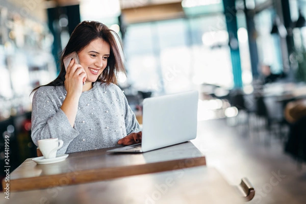 Fototapeta Business woman using smartphone