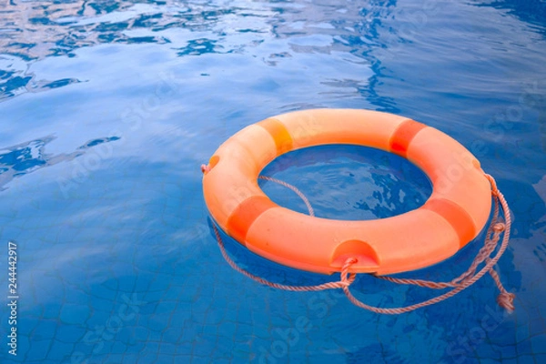 Fototapeta life ring floating in the empty swimming pool for relax peaceful the concept..