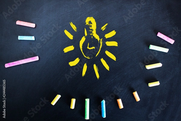 Fototapeta colorful chalk with bulb on board