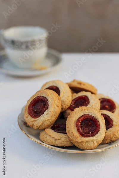 Fototapeta Thumbprint cookies filled with strawberry jam