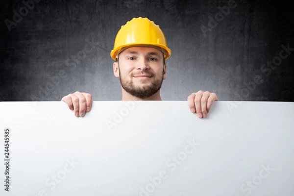 Obraz Worker holding blank board