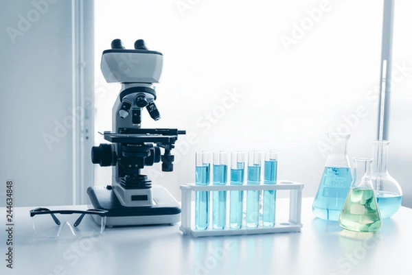 Fototapeta Laboratory microscope of healthcare and medicine researcher scientist with lab equipment tools on the table., Science technology analysis instrument, Working space for research in science laboratory..