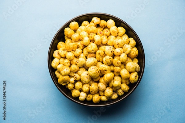Obraz Roasted Phool Makhana or Crispy Lotus pops Seed served in a bowl, selective focus