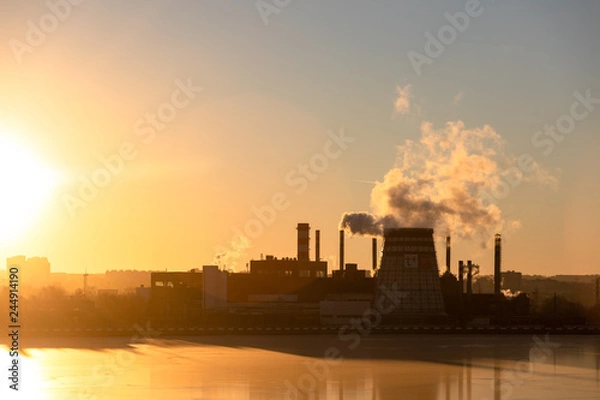 Fototapeta Type of industrial pipes from which smoke. Industrial waste pollutes the atmosphere of the earth